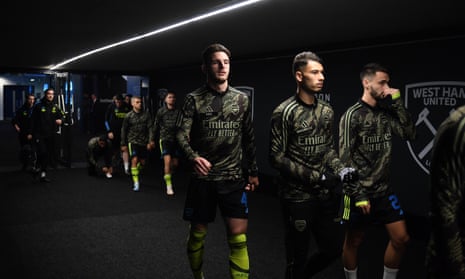 Declan Rice and team mates of Arsenal enter the pitch to warm up prior to the Carabao Cup Fourth Round match between West Ham United and Arsenal at London Stadium.