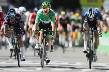 Mark Cavendish of the Deceuninck Quick-Step team celebrates as he crosses the finish line to win the 13th stage of the Tour de Frances 