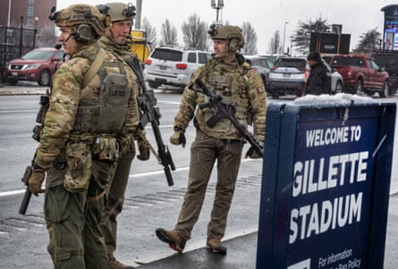 Massachusetts State Police, successful subject uniforms and toting rifles, patrol extracurricular of Gillette Stadium connected December 14, 2025.