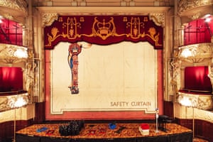 The ornate golden stage and safety curtain.