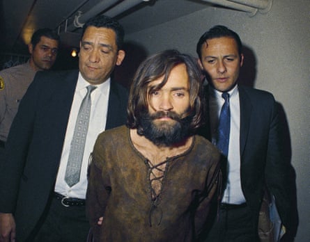 Cult leader Charles Manson is escorted to his arraignment on conspiracy-murder charges in connection with the Sharon Tate murder case in 1969.
