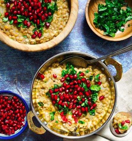 An image of food topped with pomegranate.