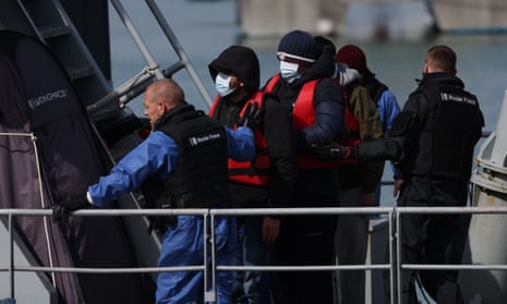People arrive at Dover on Sunday after being picked up in the Channel by Border Force