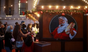 Covid news live: WHO declares 2022 to be the year ‘we end the pandemic’ as US says Omicron is now dominant strain 4 People visit a Christmas market in London, Britain, on 20 December as many wonder whether new Covid curbs will be introduced.
