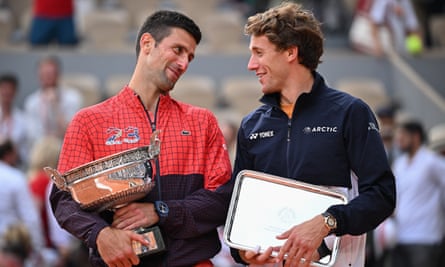 Novak Djokovic and Casper Ruud of Norway pose with their winners and runners up trophies after the Men's Singles Final on 11 June.