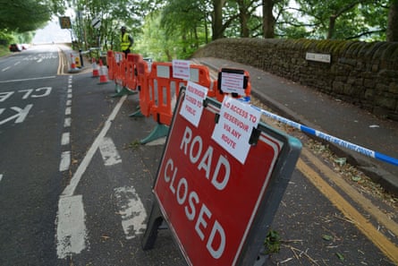 A closed road with a red sign in Greenfield near Manchester