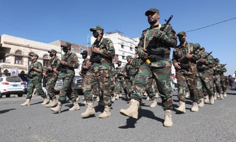 Houthi fighters take part in a parade during a mobilisation campaign in Sana’a, Yemen.