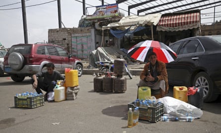 Dealers wait for customers to buy black market fuel amid an acute shortage of fuel in Sanaa, Yemen. 