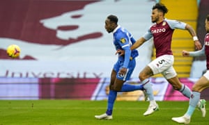 Danny Welbeck dinks the ball into the net for the first goal of the game.