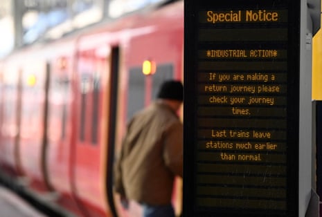 A traveller boarding a train at Waterloo Station in London today