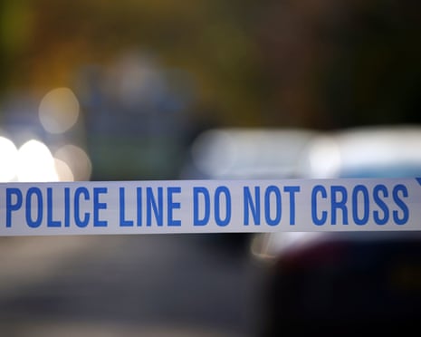 Police tape near a scene of a suspected crime