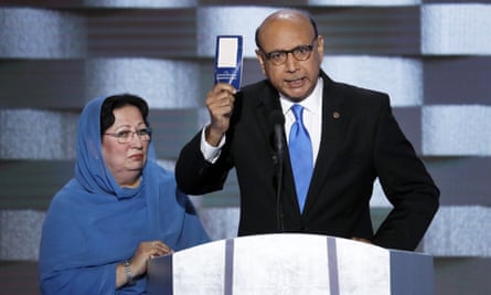 Khizr Khan, father of fallen US army captain Humayun Khan holds up a copy of the constitution as his wife listens at the 2016 Democratic national convention in Philadelphia.