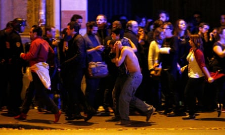 Wounded people are evacuated outside the Bataclan concert hall.