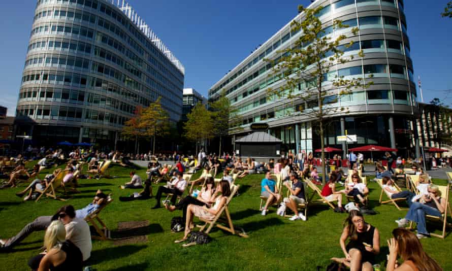 Workers enjoying the sunshine in the Spinningfields business quarter.