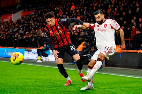 James Hill of Bournemouth (left) is beaten by Mohamed Salah of Liverpool who puts in a cross.