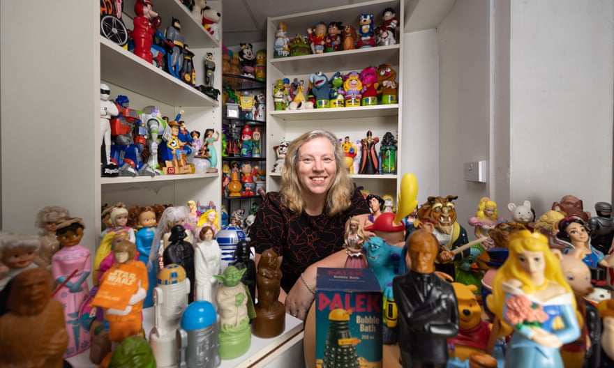 Beverly Hayworth with her collection of 800 bubble bath bottles