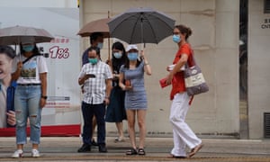 People are seen in a street of Wan Chai in south China’s Hong Kong, 29 July 2020.