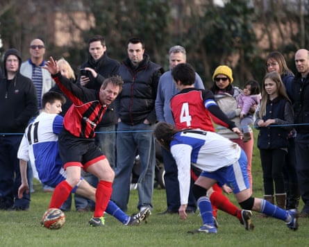 Stuart Peace is tackled by a Wotton Rovers during Longford AFC defeat in 2016.