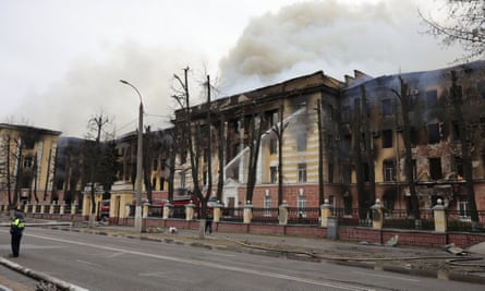 Firefighters hose down the burning building of the Central Research Institute of the Aerospace Defense Forces in the Russian city of Tver