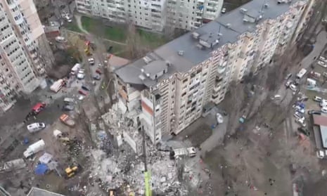 A drone view shows rescue crews working at the site of a residential building heavily damaged by a Russian drone strike in Odesa.