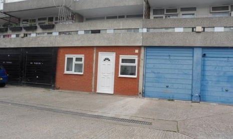 Exterior view of the converted one-bedroom garage flat sitting in a line of garages