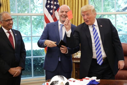 Gianni Infantino laughs as Donald Trump shows the red card to members of the media during his first term of office in 2018, during which time the US won the joint hosting rights of the 2026 World Cup.