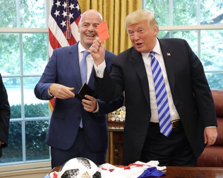 President Trump Meets With FIFA President Gianni Infantino At White House<br>WASHINGTON, DC - AUGUST 28: U.S. President Donald Trump pretends to give a red card to members of the news media while meeting with FIFA President Gianni Infantino (C) and U.S. Soccer President Carlos Cordeiro in the Oval Office at the White House August 28, 2018 in Washington, DC. The 2026 FIFA World Cup will be jointly hosted by the United States, Canada and Mexico and will be the first World Cup in history to be held in three countries at the same time. (Photo by Chip Somodevilla/Getty Images)
