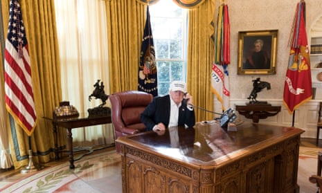 Donald Trump is seen in the Oval Office, in a White House handout picture.
