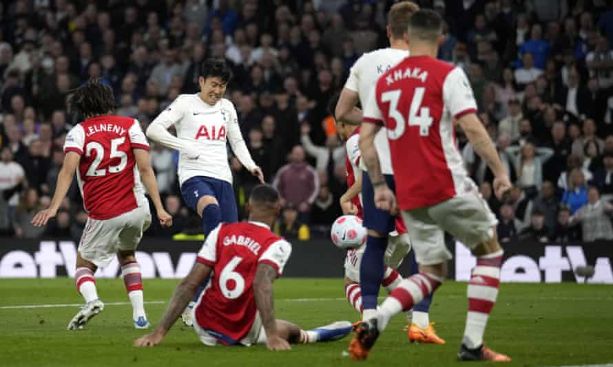 Tottenham's Son Heung-min (left) scores against Arsenal during the Premier League match at the Tottenham Hotspur Stadium.