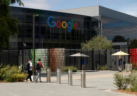 People walking near a building on Google’s campus.