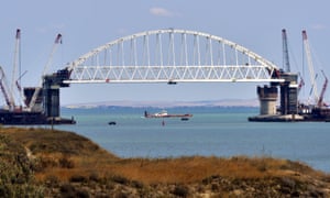 The railway arch being lifted into place over the Kerch Strait