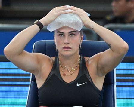 Aryna Sabalenka applies a pack of ice on her head during her defeat of Rebecca Sramkova at the Wuhan Open