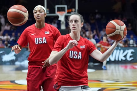 Angel Reese and Caitlin Clark warm up for a World Cup game.