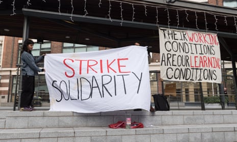 Students show support for striking academic and support staff at the London School of Economics on Thursday.