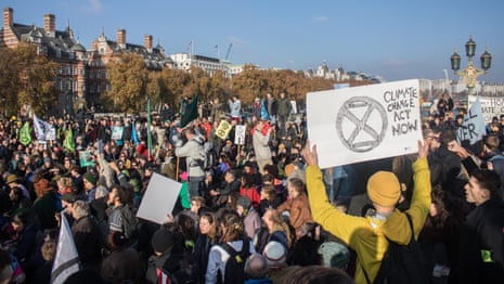 Thousands block five London bridges to protest over climate crisis – video