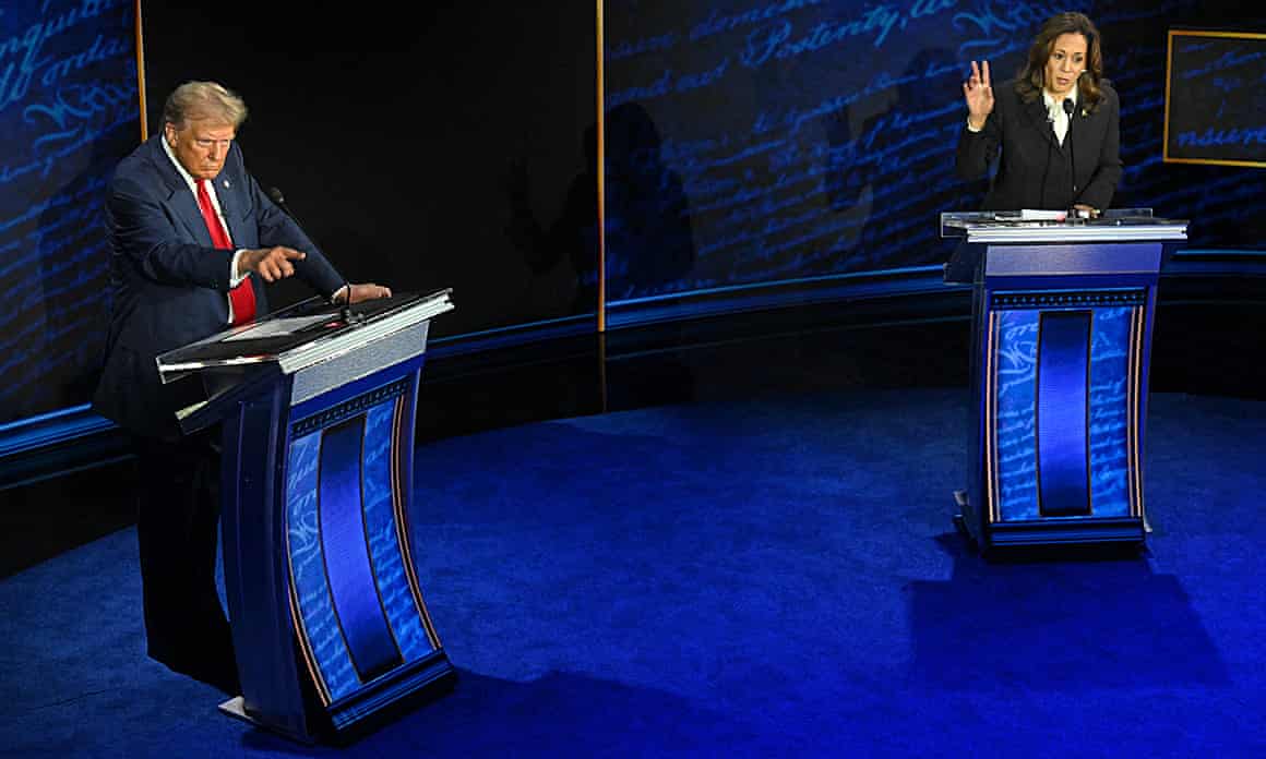 Donald Trump and Kamala Harris gesture behind podiums on stage during their first debate.
