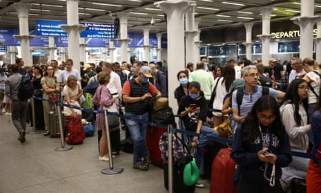 Eurostar passengers queue to check in at London st pancras