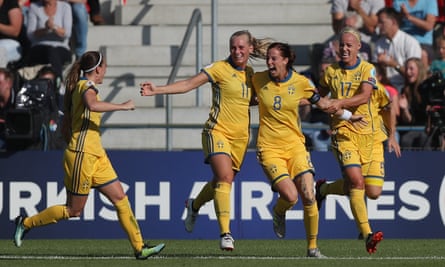 Lotta Schelin (No8) celebrates with her Sweden team-mates after scoring the opening goal.