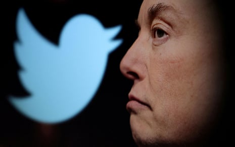 Close-up shot of Elon Musk's face with a blue Twitter logo in the background.