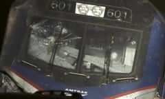 This May 12, 2015 photo shows a broken windshield of an Amtrak train after it derailed in Philadelphia.  The FBI has been called in to investigate the possibility that the windshield of the train was hit with an object shortly before deadly train derailment. The revelation came at a National Transportation Safety Board briefing on Friday evening, raising new questions about the accident.  (Elizabeth Robertson/The Philadelphia Inquirer via AP)  MANDATORY CREDIT  PHIX OUT; TV OUT; MAGS OUT; NEWARK OUT