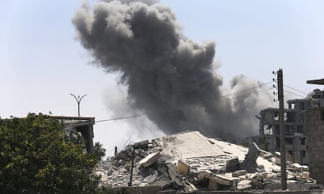 Smoke rises from a coalition airstrike on the eastern side of Raqqa on 26 July, when 62 civilians were reportedly killed by such attacks.