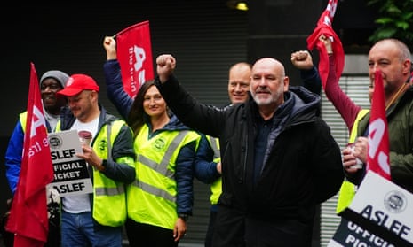A photo of Aslef general secretary Mick Whelan on a picket line at Euston station in London.