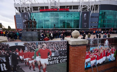 Fans wait at Old Trafford stadium, ready to pay their respects to Sir Bobby Charlton, ahead of his funeral cortege passing on its way to Manchester cathedral.