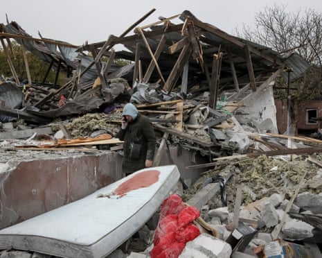 A man stands at the site of his parents' private house, destroyed during a Russian air strike, amid Russia's attack on Ukraine, on the outskirts of Dnipro, Ukraine.