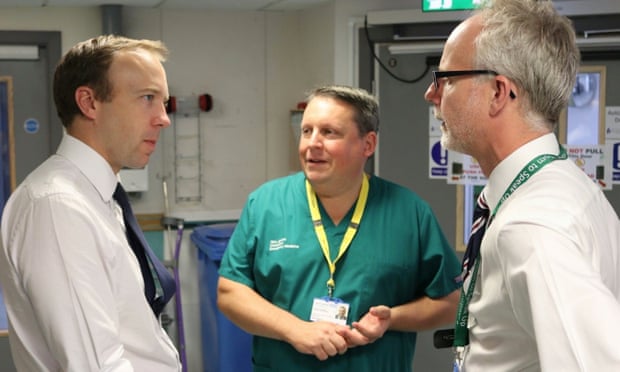 The health secretary, Matt Hancock, chats to Stephen Dunn, chief executive of West Suffolk NHS foundation trust and the hospital’s medical director Nick Jenkins