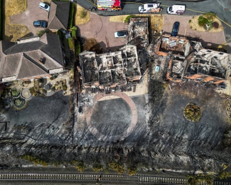 A drone view of burnt-out houses following a large grass fire which spread to several homes yesterday during the hottest day of the year, in Stourbridge, West Midlands.