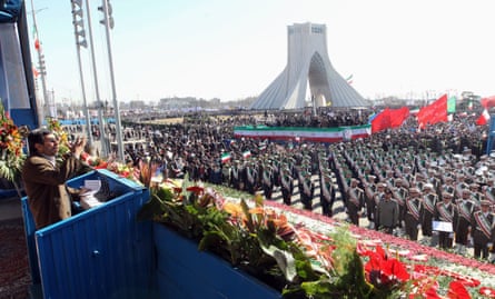 Mahmoud Ahmadinejad delivers a speech to a large crowd including many in uniform