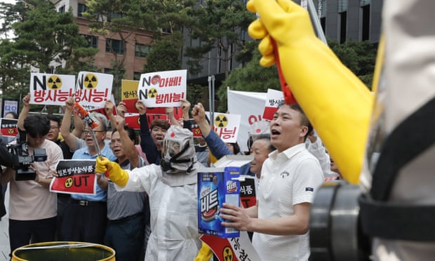South Korean business owners and workers call for a boycott of Japanese products during a protest near the Japanese embassy in Seoul.