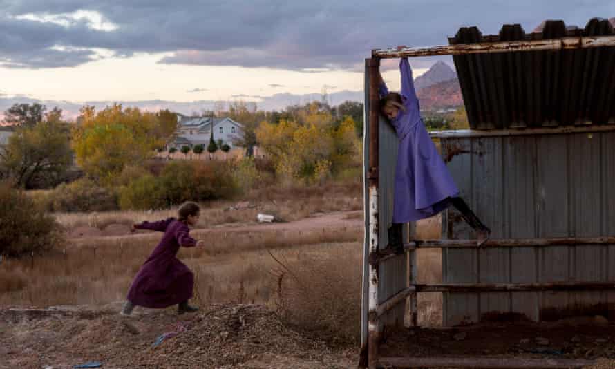 FLDS girls, Lydia Richter, 8, and Kathy Bistline, 8, play in a makeshift stable in Colorado City, Arizona