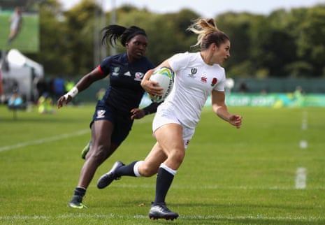 Amy Wilson Hardy of England takes the ball past Cheta Emba of USA to score a try.